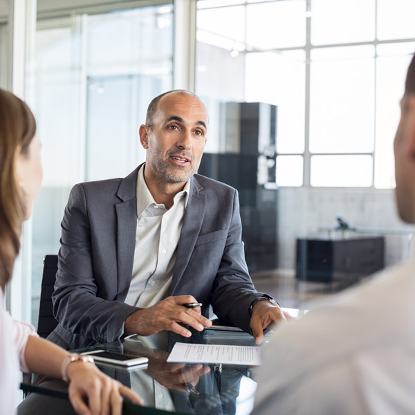 agent discussing with two clients